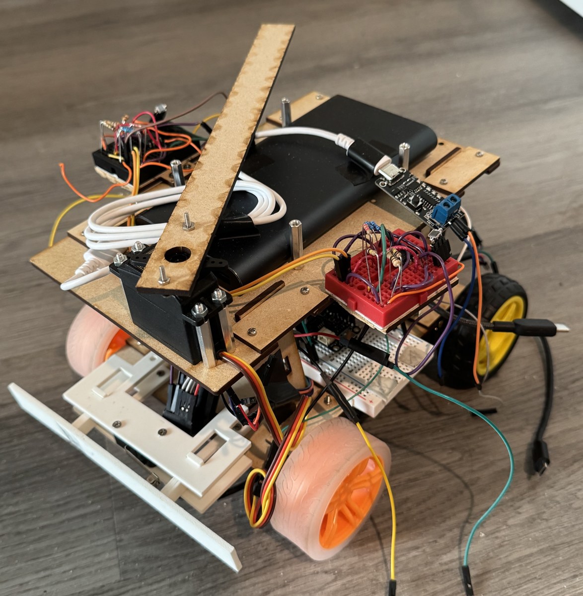 Closer view of the robot's bumper, MDF cross-bracing, electronics and upper mechanism