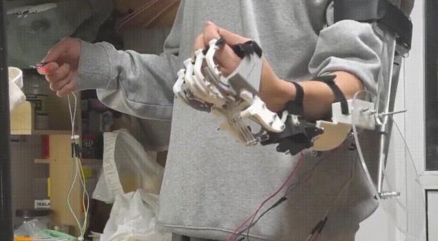 Wearable upper-limb robot with hand, wrist and elbow mechanisms